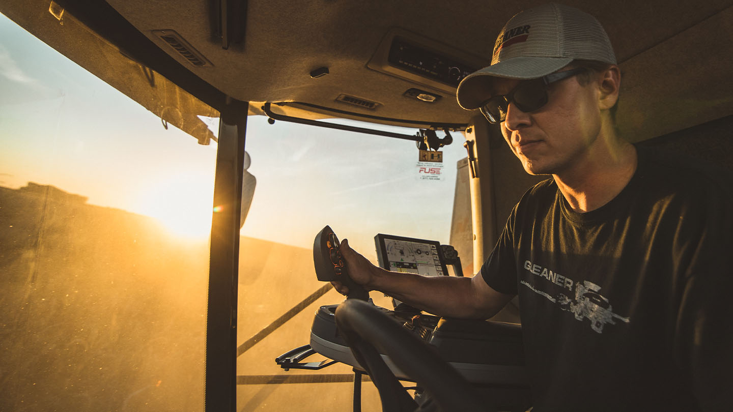 Farmer in a Gleaner Combine cabin